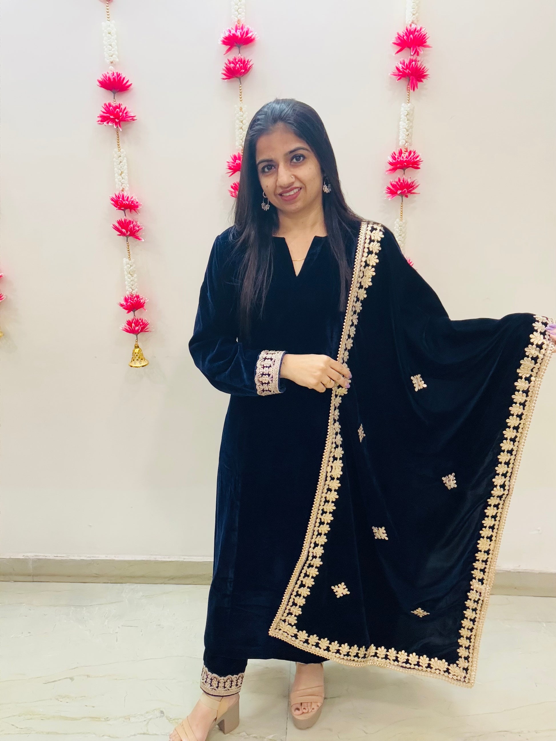 Navy blue velvet A-line suit set for women with princess cut silhouette, lace detailing, and matching velvet dupatta – perfect for festive and winter occasions.